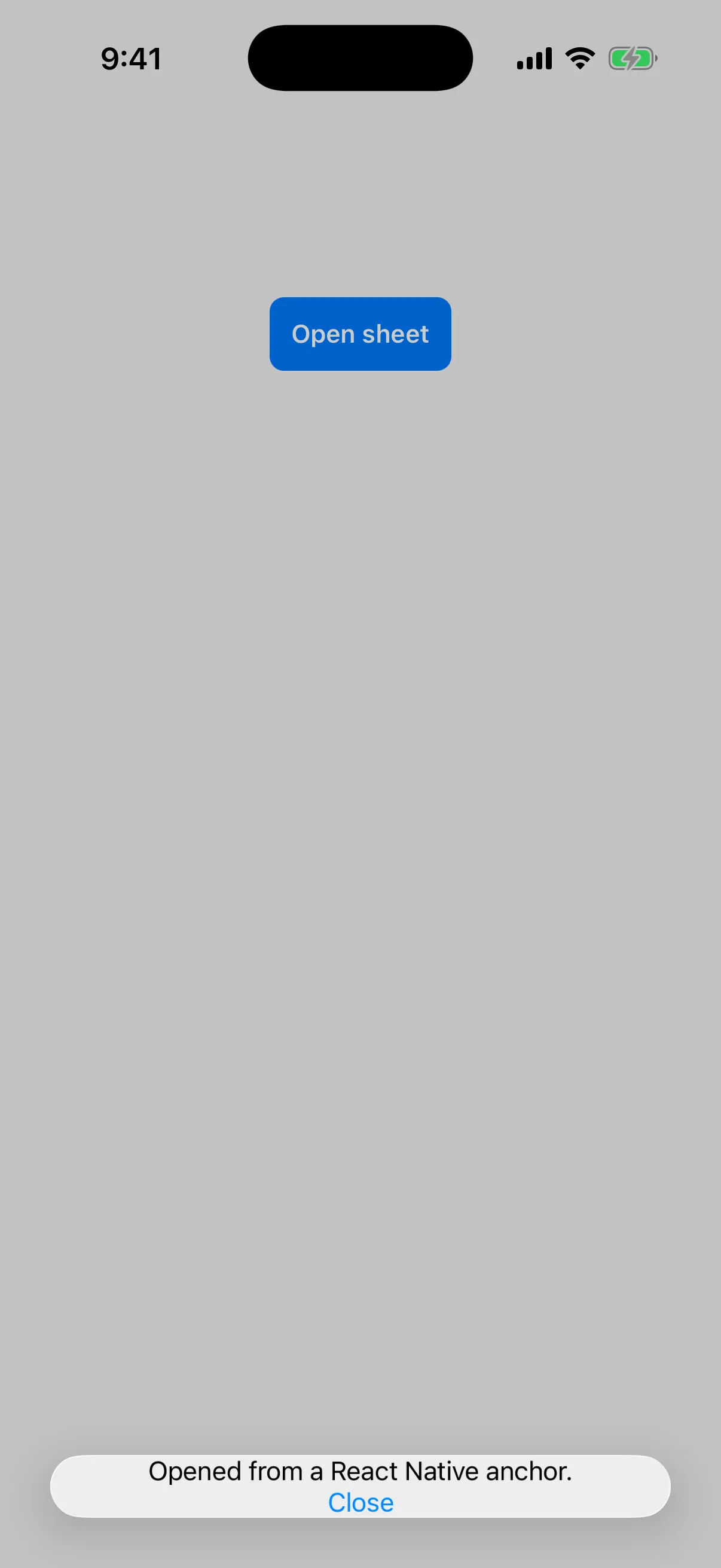 A blue React Native button above a bottom sheet sized to its content
