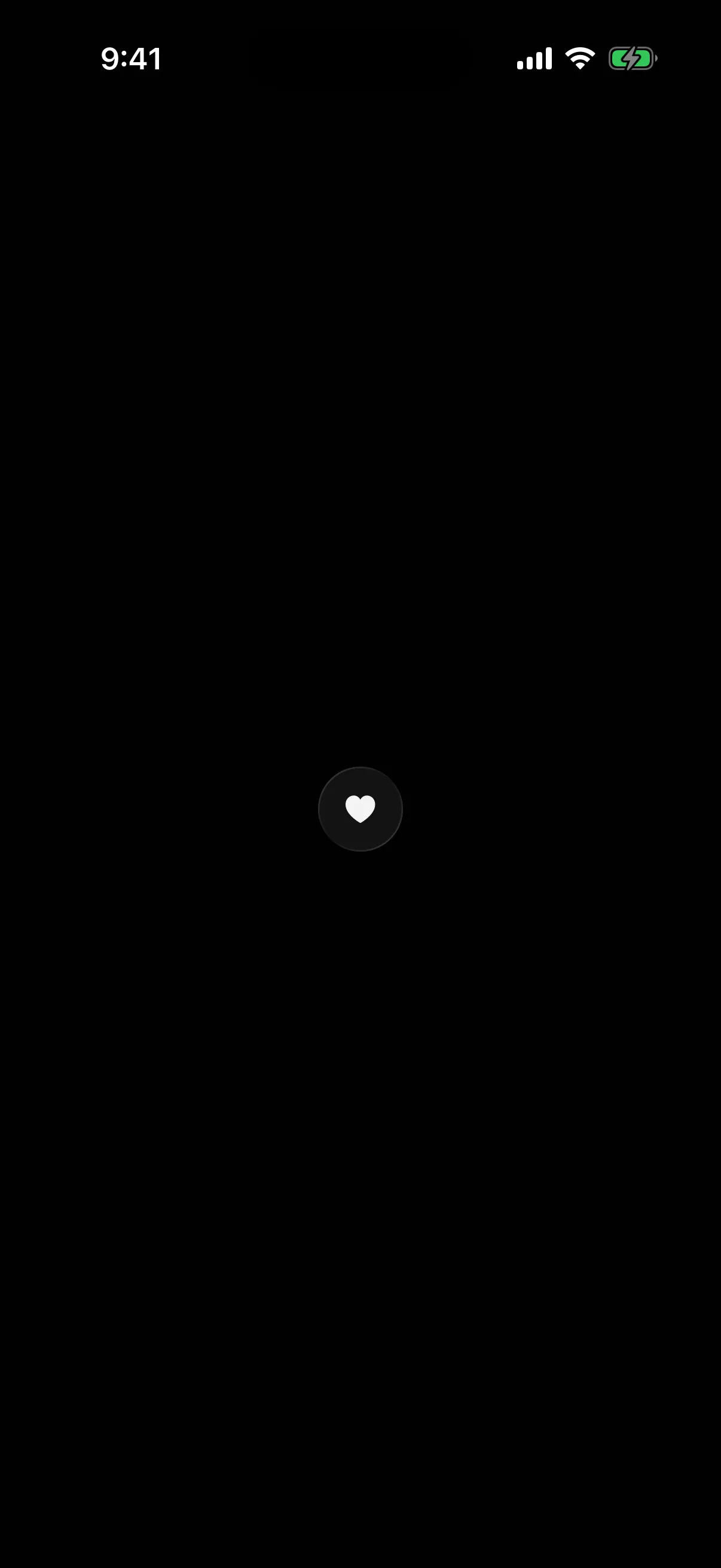 A circular glass button holding a heart icon